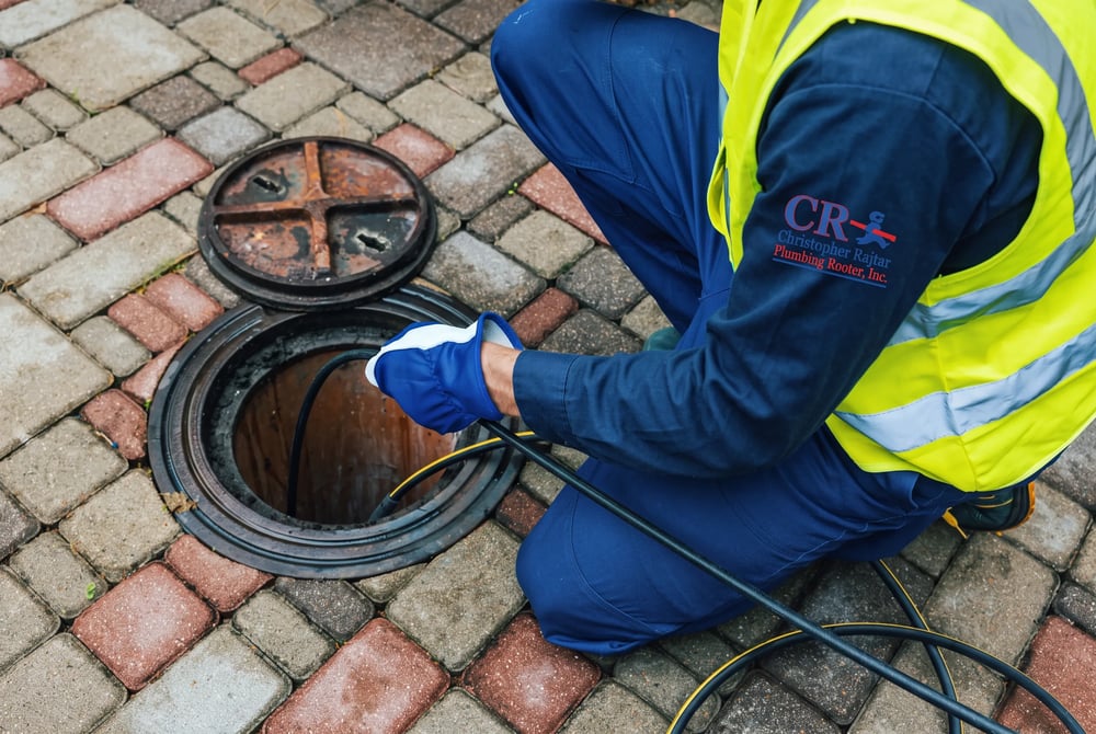 High-pressure hydro jetting clearing grease and roots from a sewer line in La Crescenta